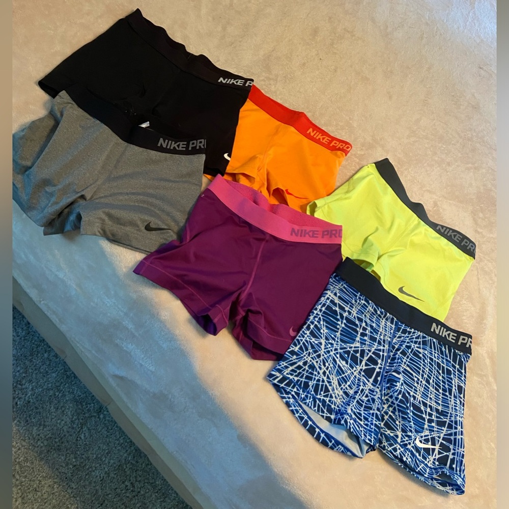 6 pairs of medium Nike Pro spandex shorts